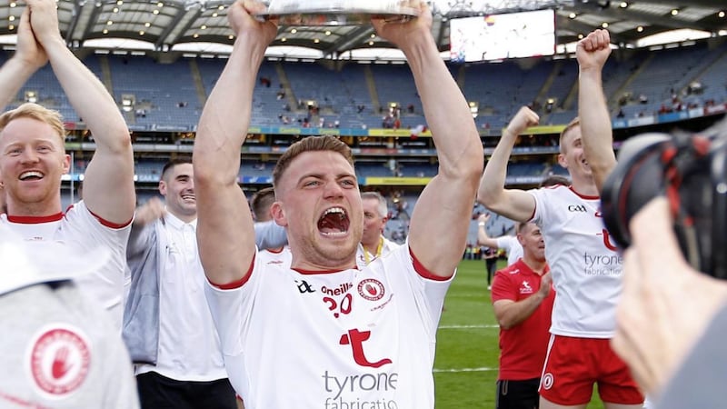 Niall Kelly lifts the Sam Maguire Cup aloft after Tyrone's triumph in September. <br />Pic Philip Walsh