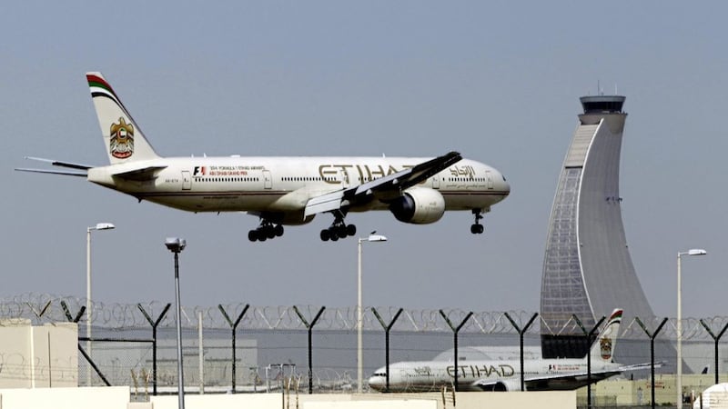 An Etihad Airways plane prepares to land at the Abu Dhabi airport in the United Arab Emirates 
