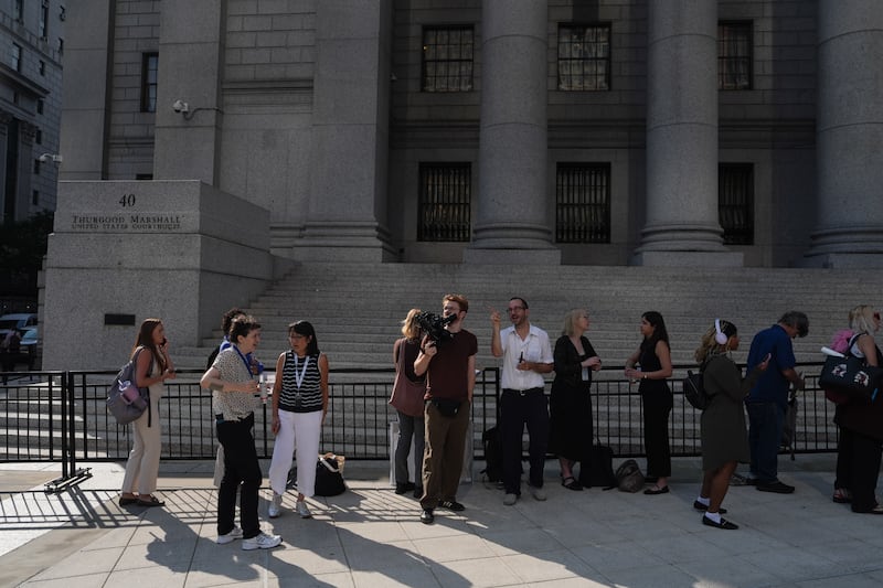 Members of the media wait in line outside Manhattan Federal Court on the day of a hearing for Luigi Mangione in New York (Ryan Murphy/AP)