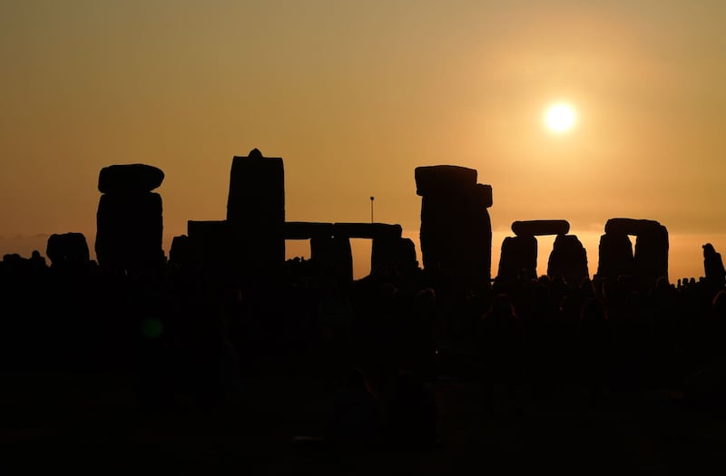 People celebrate winter and summer solstices at the stones (Andrew Matthews/PA)