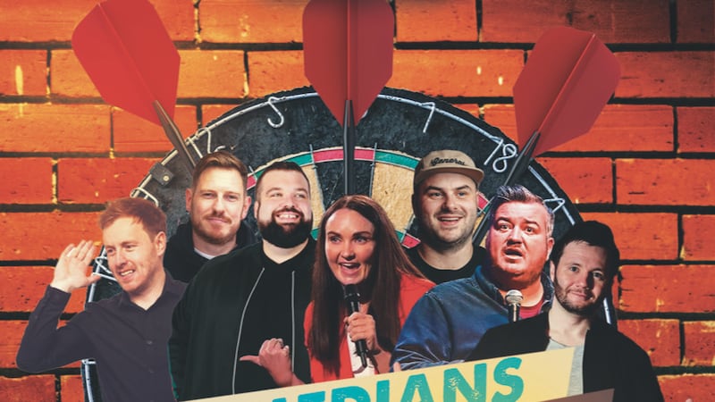Comedians infront of a darts board