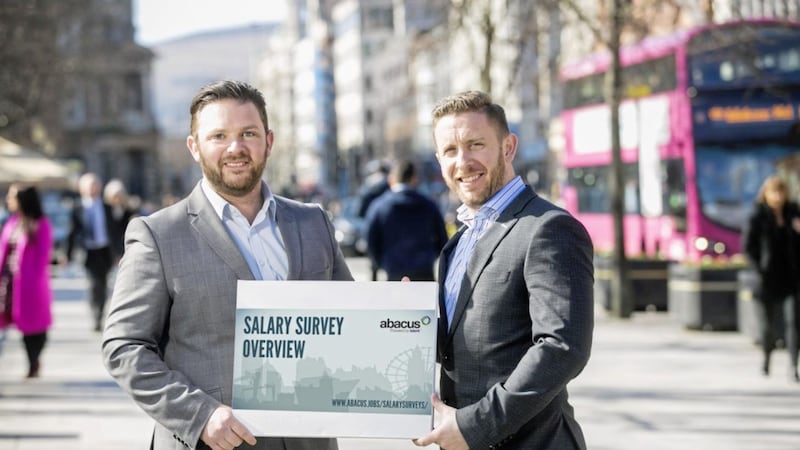 New research from Abacus Professional Recruitment shows Northern Ireland companies are delivering increasingly competitive workplace packages including salary increases, flexible working, bonuses and professional membership. Pictured are: Abacus associate directors; Stuart John, head of legal recruitment and Damian Farrell, head of financial services. 