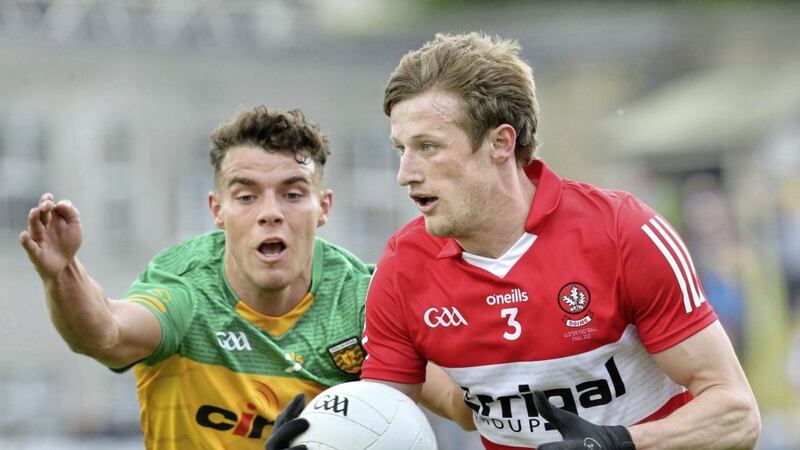 Derry Brendan Rogers with Odhran McFadden Ferry of Donegal in the Ulster SFC Final at Clones on Sunday. <br />Picture Margaret McLaughlin