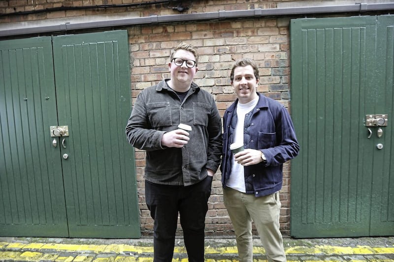 Neighbourhood Caf&eacute; proprietors Ryan Crown and Oisin McEvoy outside their new Cathedral Quarters premises in Commercial Court. Picture by Hugh Russell. 