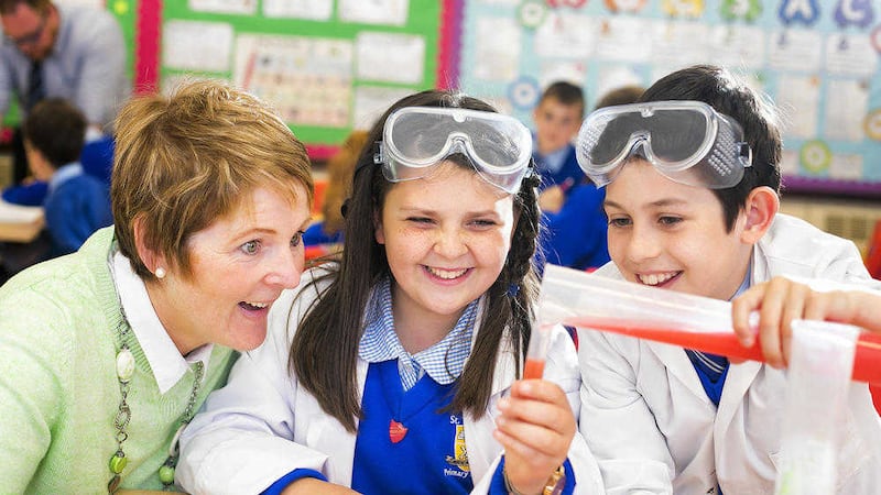Liz Branniff of St Teresa&#39;s PS with P7 pupils Nia Austin and James Kinnard. Picture by Brian Morrison 