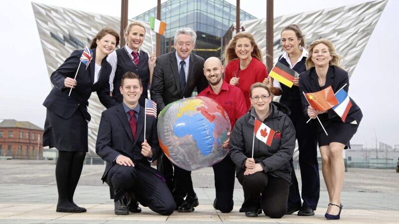 Tourism NI&rsquo;s chief executive, John McGrillen is pictured alongside Titanic Belfast&rsquo;s chief executive, Judith Owens and crew who have been working at the world-leading tourist attraction since opening in 2012, as it celebrates its busiest year to date. 