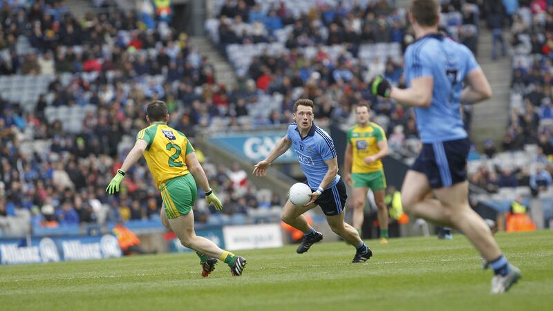 Dublin's Paul Flynn gets the ball away as Donegal's Paddy McGrath hovers during Sunday's Allianz National Football League semi-final at Croke Park<br/>Picture by Colm O'Reilly &nbsp;