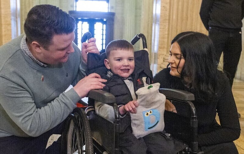 Young Dáithí pictured with parents Mairtin Mac Gabhann Seph Ni Mheallain at Stormont in February. 