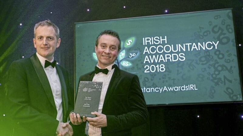 Gary Cullen, director of Harvest Financial Services, presents the Tax Team of the Year award to PKF-FPM director Malachy McLernon at the Irish Accountancy Awards in Dublin 