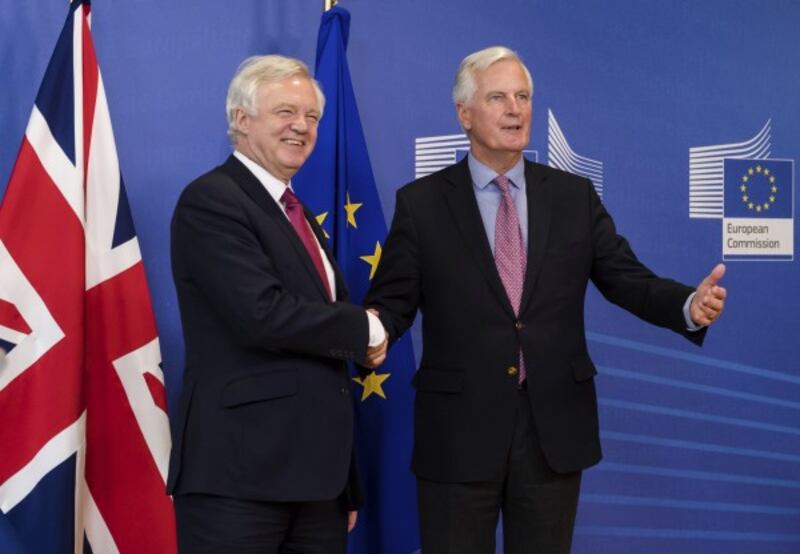 EU Chief Brexit Negotiator Michel Barnier, right, and British Secretary of State David Davis