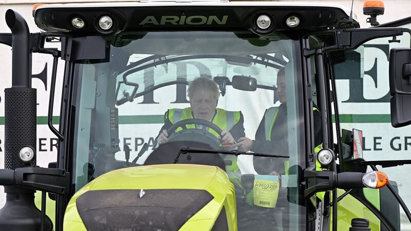 Boris Johnson is instructed as he drives a tractor during a visit to Southern England Farms Ltd in Hayle, Cornwall, ahead of the publication of the UK government's food strategy white paper, Cornwall. Picture by Justin Tallis/PA Wire&nbsp;