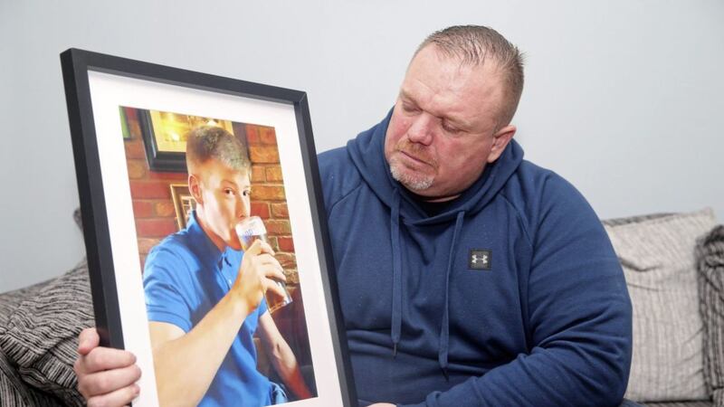 Christopher Connor holds a picture of his son Aaron (21). Picture by Mal McCann 
