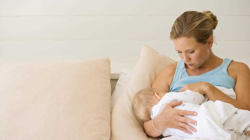 A woman breastfeeding her baby 