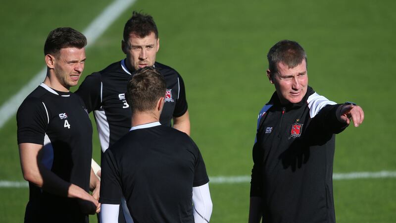 Dundalk manager Stephen Kenny chats with players Andy Boyle (left), Brian Gartland and Dane Massey during a training session &nbsp;