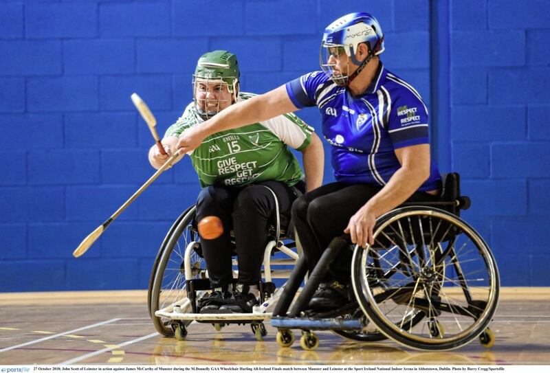 John Scott of Leinster in action against James McCarthy of Munster during the M.Donnelly GAA Wheelchair Hurling All-Ireland Finals match between Munster and Leinster at the Sport Ireland National Indoor Arena in Abbotstown, Dublin on October 27 2018. Picture by Barry Cregg/Sportsfile 