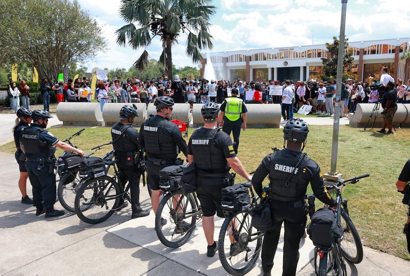 Orange County sheriffs monitor the scene as protesters chant during a demonstration in support of Palestinians at the University of Central Florida, in Orlando (Joe Burbank/Orlando Sentinel via AP)