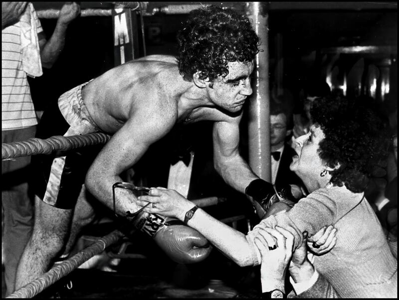 Hugh Russell leans over the ropes to kiss his mother Eileen in the Ulster hall Belfast October 1982. Picture by Brendan Murphy