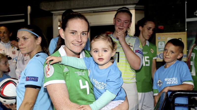 Sarah McFadden with her daughter Harper, ready to lead Northern Ireland out to face Norway in last year's Women's Euro Qualifier at Seaview, Belfast.<br /> Photo by William Cherry/Presseye