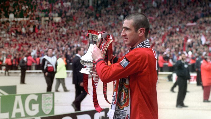 Eric Cantona, lifting the FA Cup, won the competition twice and four Premier League titles with United