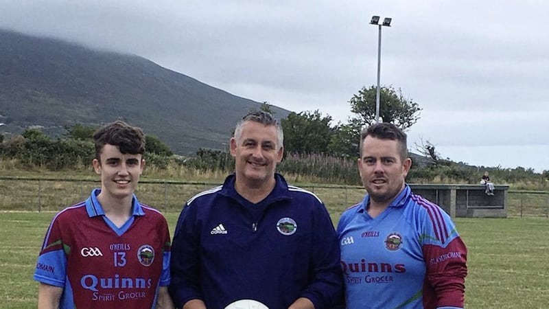 Damian Grant from Granden Design, the sponsors of the match ball, and Glasdrumman senior players Ronan Grant and Se&aacute;n Cunningham before last Friday&#39;s game against St John Bosco, Newry 