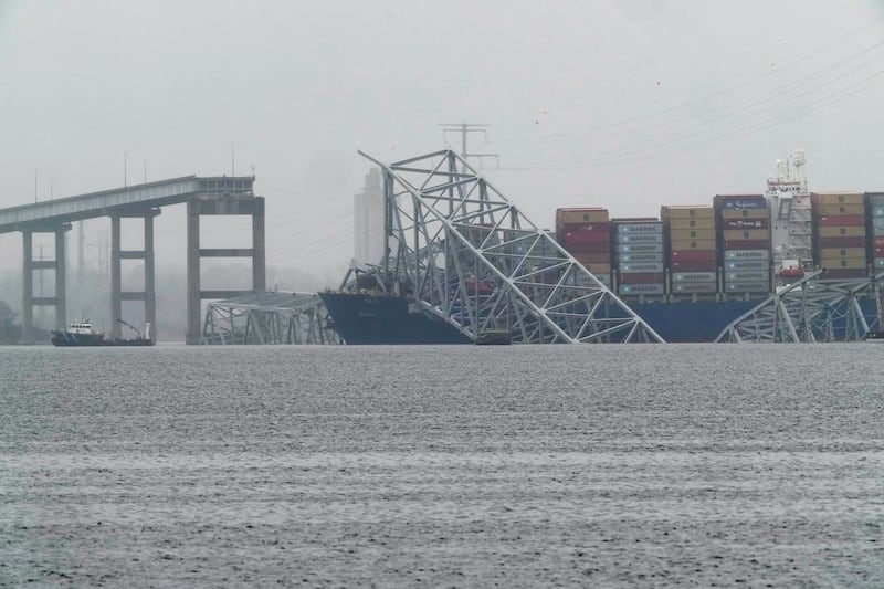 The container ship Dali rests against the wreckage of the Francis Scott Key Bridge on Thursday (Matt Rourke/AP)