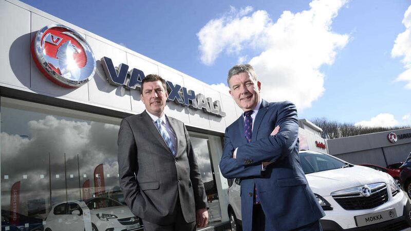 Colin McNab, right, operations director at Charles Hurst pictured with Keith Hyde franchise manager for Charles Hurst Vauxhall at the Mallusk showroom 