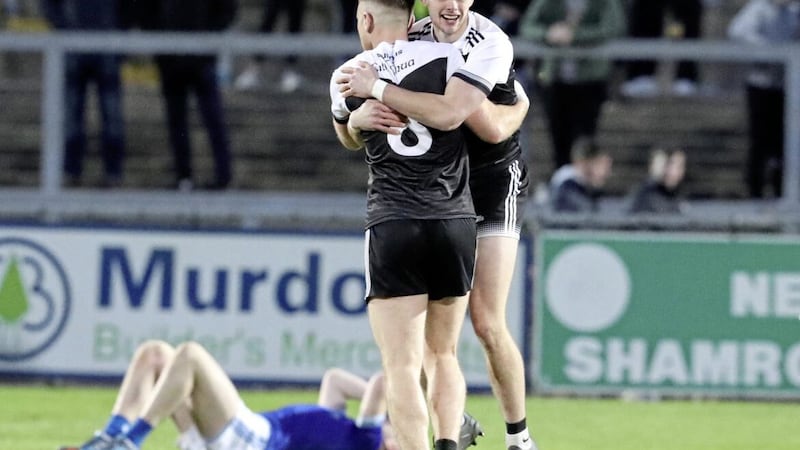 The Kilcoo players celebrate yesterday&#39;s Down title triumph, while the wait goes on for Warrenpoint. Picture by Philip Walsh 