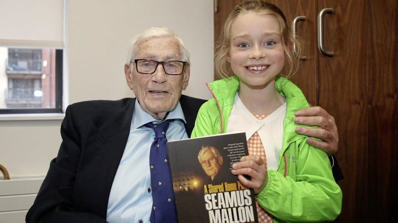 Seamus Mallon with his granddaughter Lara Lenny (9) at the launch of his book in Belfast. Picture by Declan Roughan 
