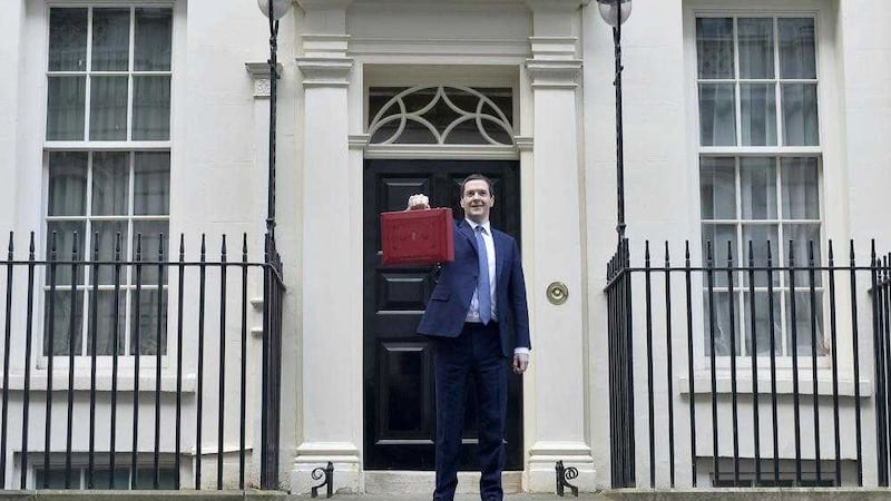 Chancellor of the Exchequer George Osborne outside 11 Downing Street before heading to the House of Commons to deliver his budget 