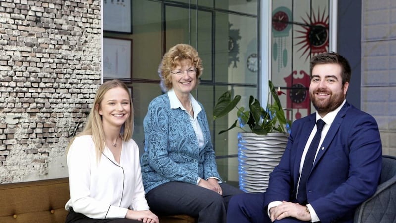 Jane Townsend (centre), partner and head of A&amp;O&rsquo;s legal services centre in Belfast, with newly recruited graduates Megan Ryans and David Hippsley 