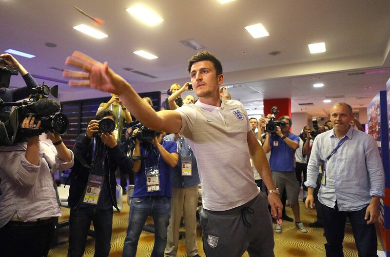 England defender Harry Maguire plays darts during the media access at Repino Cronwell Park