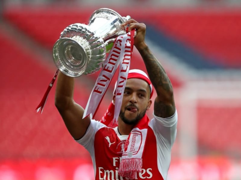 Arsenal's Theo Walcott lifts the FA Cup