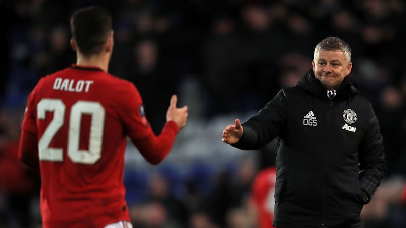 Manchester United's Diogo Dalot (left) and Manchester United manager Ole Gunnar Solskjaer shake hands after the final whistle of the FA Cup fourth round match against Tranmere Rovers at Prenton Park, Birkenhead on Sunday January 26, 2020. Picture by Simon Cooper/PA Wire.&nbsp;
