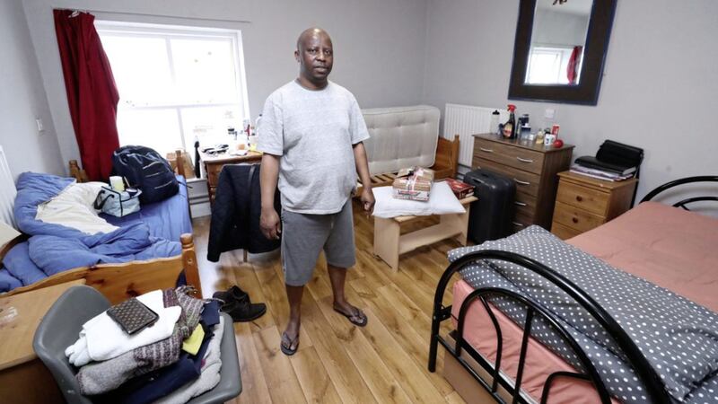 Lesley Mkoko in the Direct Provision room that he shares with two other men in Waterford. Picture by Niall Carson/PA 