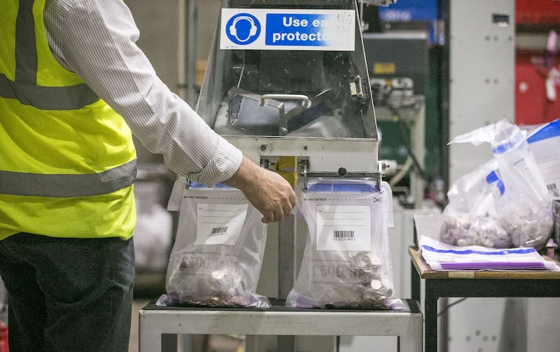 &nbsp;A currency processor maintains the sorting machine as it bags new one pound coins during a visit from Exchequer Secretary to the Treasury, Andrew Jones MP to the G4S Cash Solutions Facility in Newtownabbey near Belfast. Liam McBurney/PA Wire