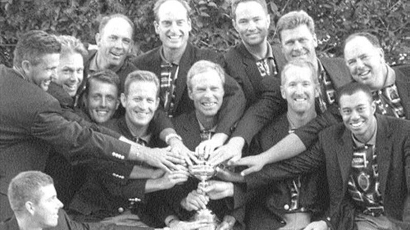 GOLDEN MOMENT...The victorious American Ryder Cup team pose with the trophy after their dramatic triumph at Brookline 