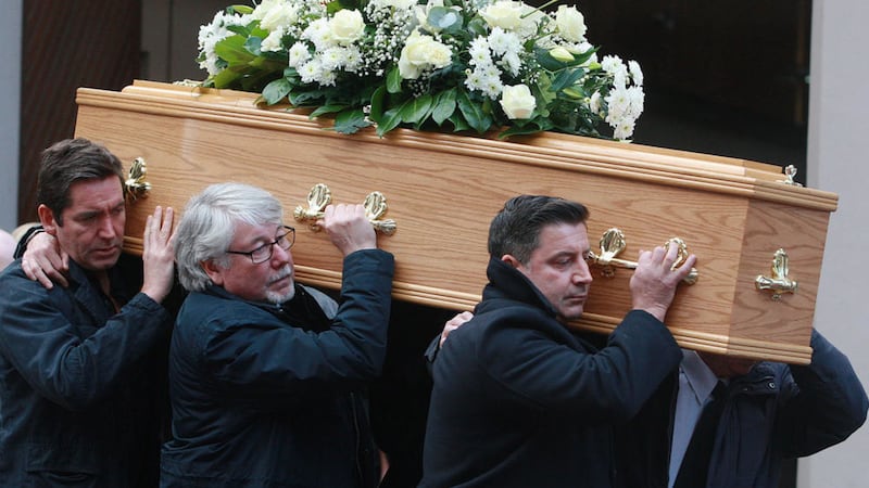 The coffin of Belfast singer-songwriter Bap Kennedy is carried from O&#39;Kanes in Donegall Street. Picture by Bill Smyth  