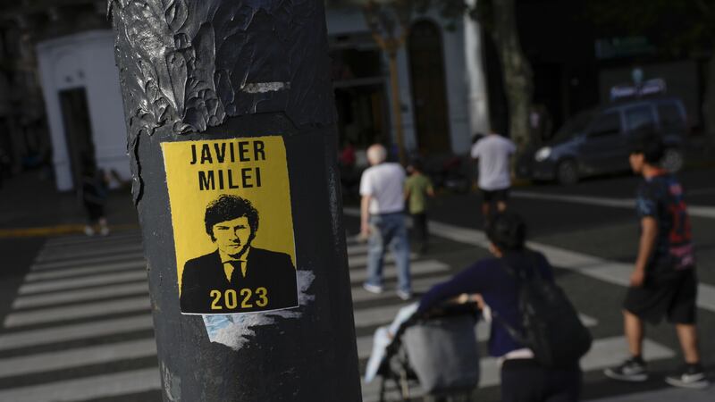 A campaign poster promoting the Liberty Advances coalition candidate Javier Milei is displayed on a pole, a day ahead of the presidential run-off, in Buenos Aires, Argentina (Matias Delacroix/AP)