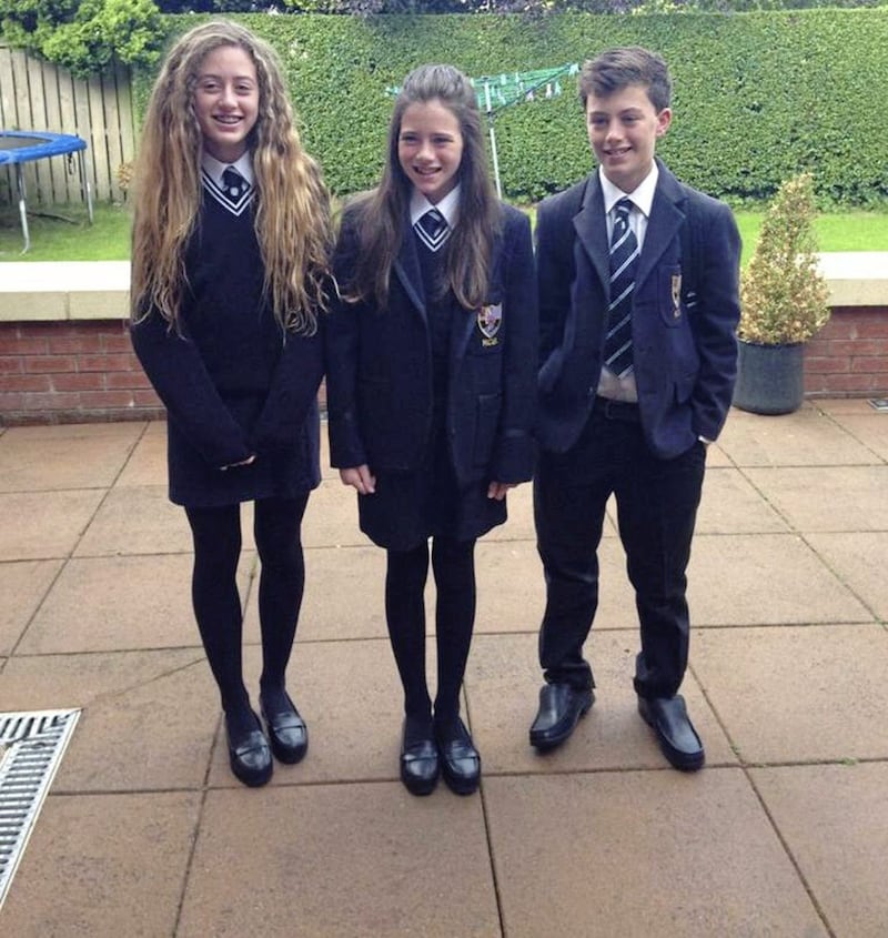 Methody pupil Olivia Neill (centre) with her brother Matthew and sister Emma 