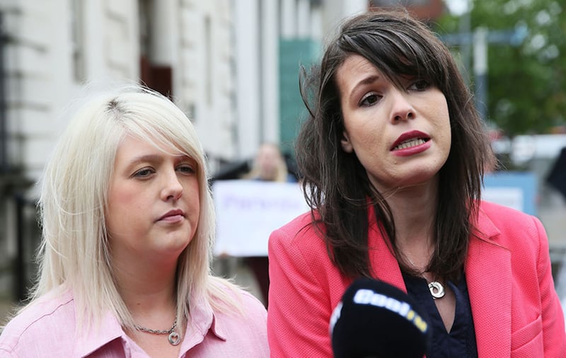 Pro-choice campaigner Sarah Ewart (left), who had to travel to England for an abortion due to fatal foetal abnormality, and Grainne Teggart of Amnesty International, speak to media outside the Royal Courts of Justice, Belfast, where the Court of Appeal allowed an appeal against a lower court's ruling that abortion legislation was incompatible with the UK's Human Rights Act&nbsp;