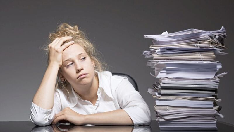 Photo of burnout office worker lying on desk 