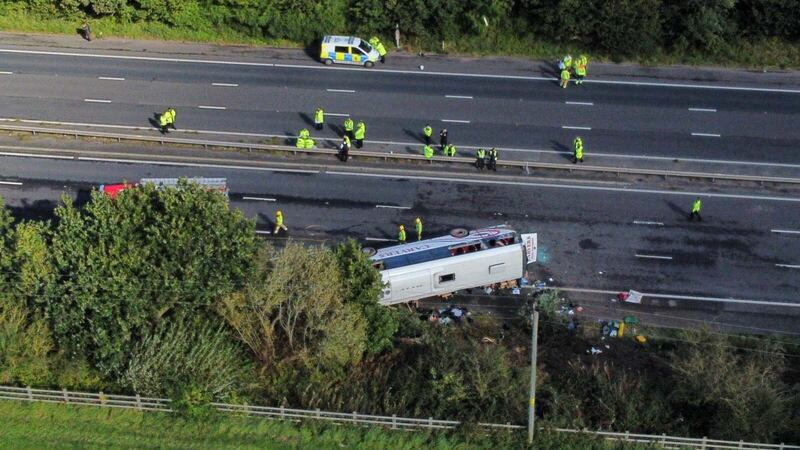 Emergency services at the scene of a coach crash on the M53 motorway (Peter Byrne/PA)