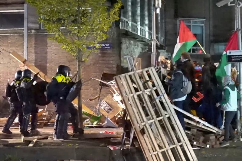 Police arrest some 125 activists as they broke up a pro-Palestinian demonstration camp at the University of Amsterdam (InterVision/AP)