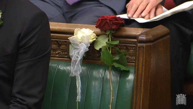 A white and red rose lie on Jo Cox&#39;s empty seat in the House of Commons. Picture by PA Wire 