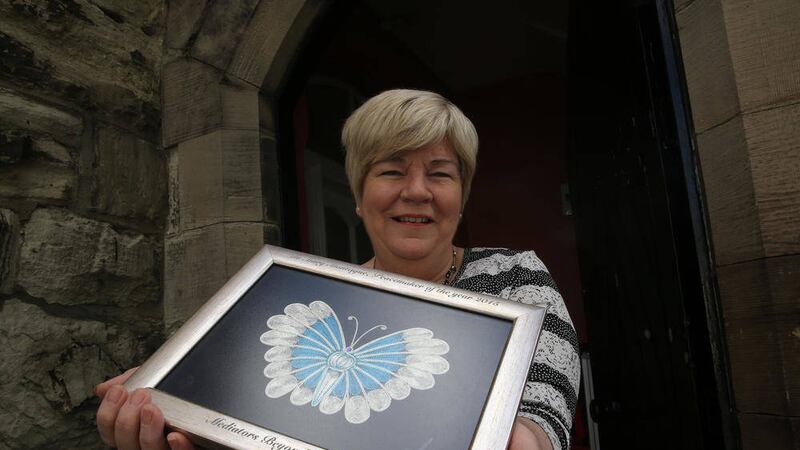 Mary Montague pictured at work with her International peace award. Picture Hugh Russell 