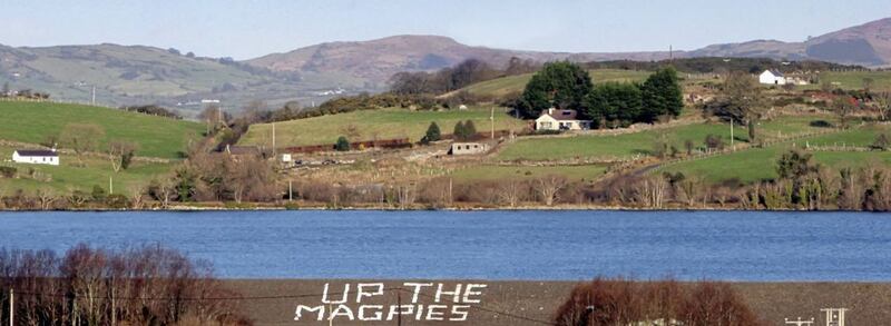 &#39;Up the Magpies&#39; in a field in Kilcoo with the Mourne Mountains and Lough Island Reavy in the background. 