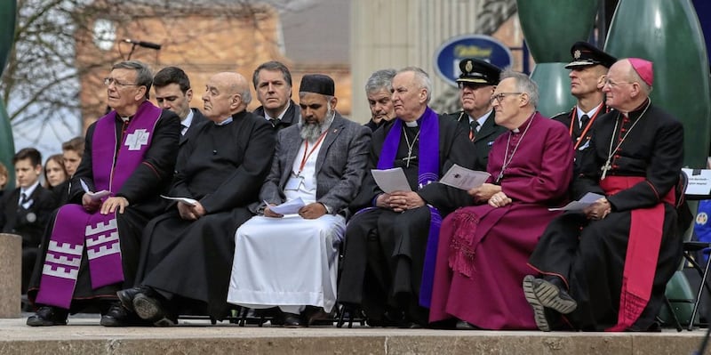 The Mayor of Greater Manchester Andy Burnham (second left) and the Mayor of the Liverpool Steven Rotheram (fourth left) sit with faith leaders, during the 25th anniversary service of the Warrington bombing, on Bridge Street, attended by the families of victims of the attack, faith leaders and representatives of the British and Irish governments. PRESS ASSOCIATION Photo. Picture date: Tuesday March 20, 2018. See PA story MEMORIAL Warrington. Photo credit should read: Peter Byrne/PA Wire. 