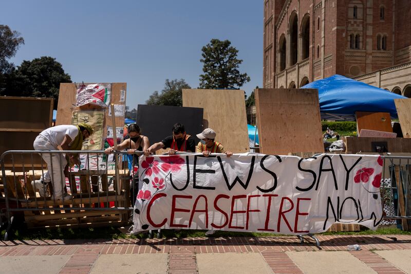 Pro-Palestinian protesters reinforce barricades around their encampment at the University of California, Los Angeles (UCLA) (Jae C Hong/AP)