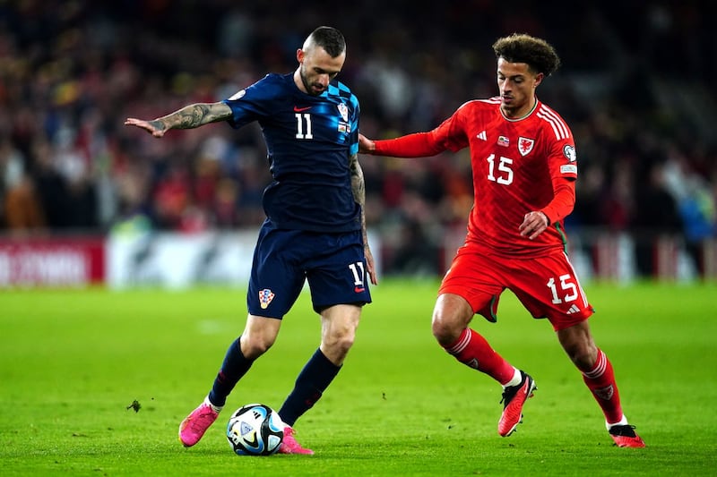 Ethan Ampadu (right), pictured in action against Croatia’s Marcelo Brozovic, has become a key player for Wales