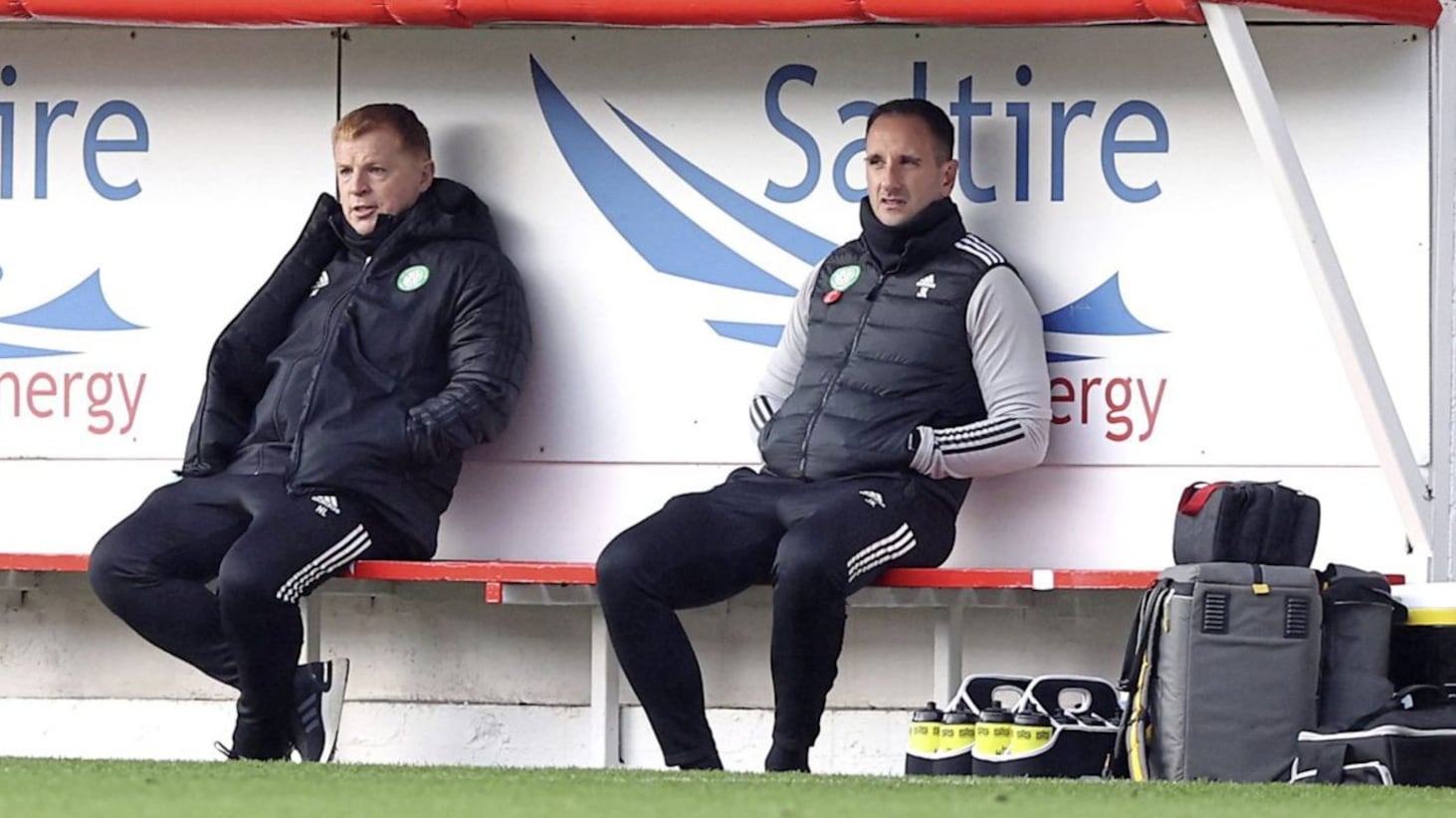 Celtic manager Neil Lennon (left) and his assistant John Kennedy on the bench during the Scottish Premiership match at Pittodrie Stadium, Aberdeen.. 